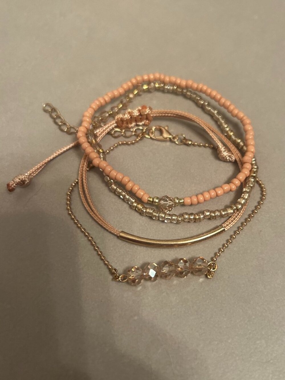 Gold and tan bracelet stack